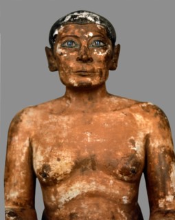 Sitting scribe in polychromed limestone, height 53 cm. belonging to the 5th Dynasty.