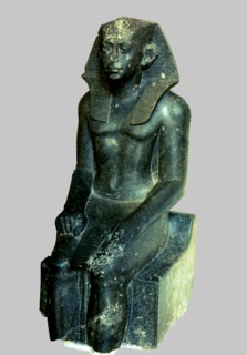 Seated statue of Sesostris III depicted as a young man, made in diorite, comes from Medamout, 187?