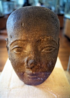 Egyptian art. Head in red granite from the New Kingdom era.