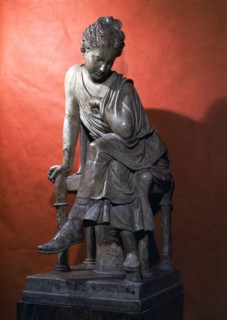 Young woman with injured arm, piece in marble.