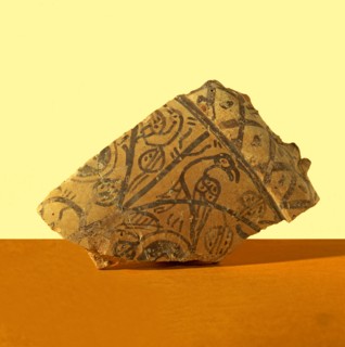 Basil collector, fragment decorated with pomegranates, with a bird resting on a branch. It belong?