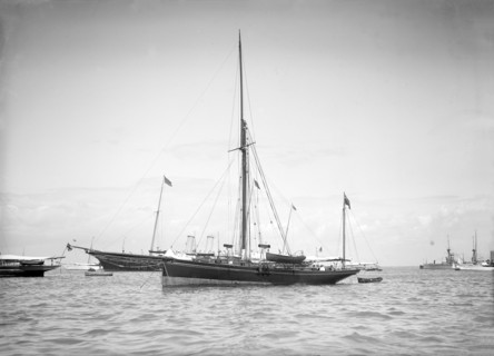 The yawl 'Beluga' at anchor, 1911. Creator: Kirk & Sons of Cowes.