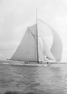 'Istria' sailing downwind under spinnaker, 1912.  Creator: Kirk & Sons of Cowes.