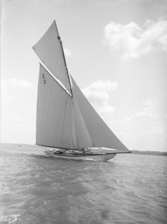 The early 12 Metre cutter 'Cintra' sailing close-hauled, 1911. Creator: Kirk & Sons of Cowes.