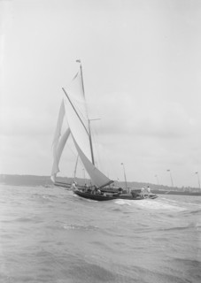 The gaff rigged cutter 'Bloodhound' sailing on a broad reach, August 1912. Creator: Kirk & Sons of Cowes.