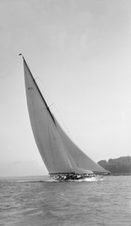 The 23-metre cutter 'Astra' sailing close-hauled, 1931. Creator: Kirk & Sons of Cowes.
