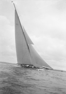 The 23-metre cutter 'Astra' sailing close-hauled, 1932. Creator: Kirk & Sons of Cowes.