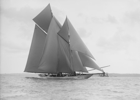 The 250 ton schooner 'Germania' sails on a reach, 1913. Creator: Kirk & Sons of Cowes.