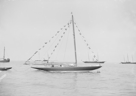 The 6 Metre 'Cremona' moored with flags, 1913. Creator: Kirk & Sons of Cowes.