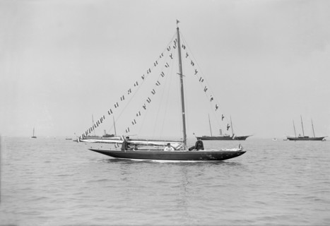 The 6 Metre 'Cremona' moored with flags, 1913. Creator: Kirk & Sons of Cowes.