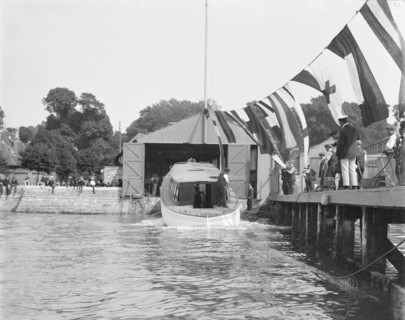 Saunders' motor launch being launched, 1908. Creator: Kirk & Sons of Cowes.