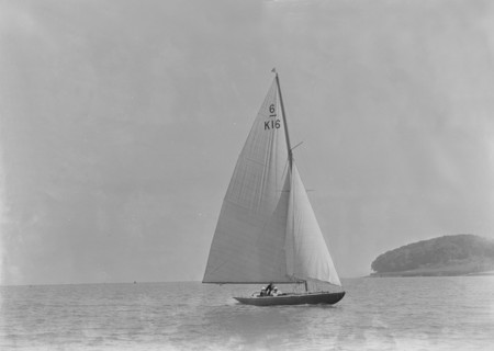 The 6 Metre class 'Jean' (K16) sailing in light winds, 1921. Creator: Kirk & Sons of Cowes.