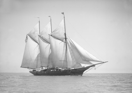 The three-mast auxiliary schooner 'Invincible', 1911. Creator: Kirk & Sons of Cowes.