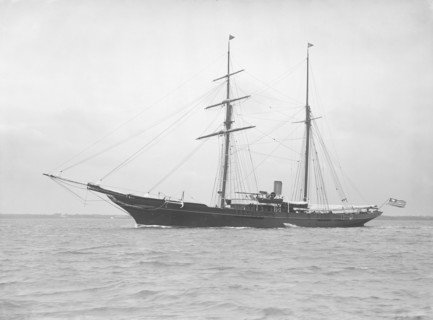 The auxiliary schooner 'Xarifa' at anchor, 1912. Creator: Kirk & Sons of Cowes.