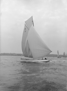 'Ventana' (H11), and early 8 Metre yacht, running downwind under spinnaker, 1913. Creator: Kirk & Sons of Cowes.