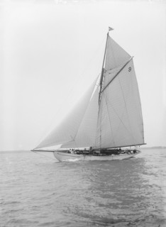 The cutter 'Westwind' sailing close-hauled, 1912. Creator: Kirk & Sons of Cowes.