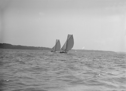 The 8 Metre sailing yachts 'Endrick' and 'Spero' racing downwind, 1911. Creator: Kirk & Sons of Cowes.