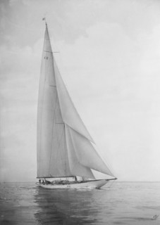 The 23 Metre 'Candida' sailing close-hauled, 1935. Creator: Kirk & Sons of Cowes.