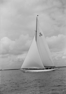 'Trivia', a 12 Metre class yacht sails close-hauled, 1939. Creator: Kirk & Sons of Cowes.
