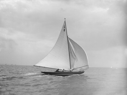 'Scotia IV' running downwind with spinnaker, 1913. Creator: Kirk & Sons of Cowes.