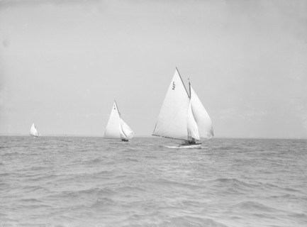 The 6 Metre 'The Whim' (L6) and 'Correnzia' racing downwind, 1911. Creator: Kirk & Sons of Cowes.