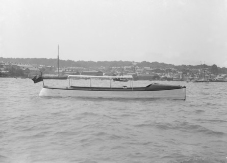 Saunders' motor launch at anchor, 1914. Creator: Kirk & Sons of Cowes.