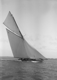 The 40-rater cutter 'Carina' heeling in good wind, 1911. Creator: Kirk & Sons of Cowes.