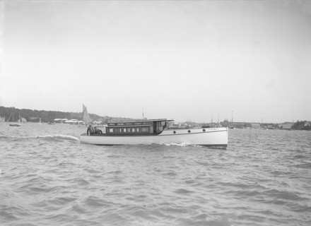 The motor launch 'Cygnet' under way, 1912. Creator: Kirk & Sons of Cowes.
