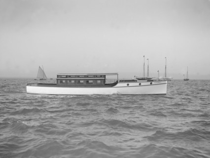 The motor launch 'Cygnet' under way, 1912. Creator: Kirk & Sons of Cowes.