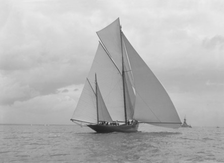 The yawl 'Harbinger' running downwind, 1922. Creator: Kirk & Sons of Cowes.