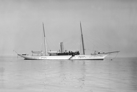 The 70 ton steam yacht 'Ombra' at anchor, 1911. Creator: Kirk & Sons of Cowes.