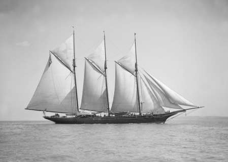 The three-mast auxiliary schooner 'Invincible', 1911. Creator: Kirk & Sons of Cowes.