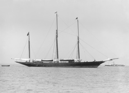 The three mast auxiliary sailing yacht 'Utopia' at anchor, 1913. Creator: Kirk & Sons of Cowes.