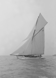 The cutter 'Westwind' sailing close-hauled, 1914. Creator: Kirk & Sons of Cowes.