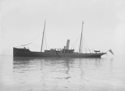 The 116 ton steam yacht 'Athena' at anchor, 1911. Creator: Kirk & Sons of Cowes.