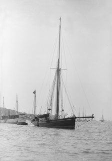 The 40 ton yawl 'Hyacinth' at anchor, 1913. Creator: Kirk & Sons of Cowes.