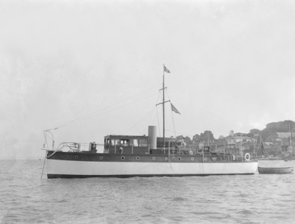 The 28 ton motor yacht 'Edina' at anchor, 1921. Creator: Kirk & Sons of Cowes.