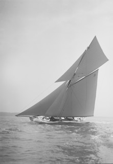 The cutter 'Rosamond' sailing close-hauled, 1911. Creator: Kirk & Sons of Cowes.