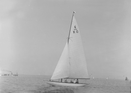 The 6 Metre 'Flya' (K13) sailing close-hauled, 1921. Creator: Kirk & Sons of Cowes.