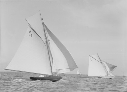 The 8 Metre 'Antwerpia' (H19) and 'Windflower' (H3) racing under spinnaker, 1911. Creator: Kirk & Sons of Cowes.