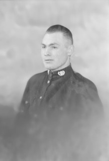 Portrait of a man in uniform, c1935. Creator: Kirk & Sons of Cowes.