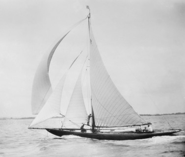 Unknown cutter sailing with spinnaker. Creator: Kirk & Sons of Cowes.