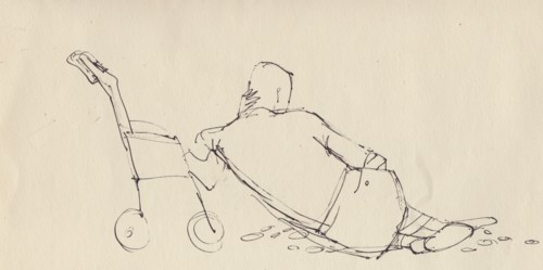 Man leaning against pushchair on the beach, c1950. Creator: Shirley Markham.