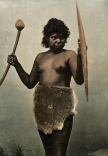 Femme Australienne Chargee Des Armes De Son Mari', (Austrailan Woman with Husbands Weapons), 1900.