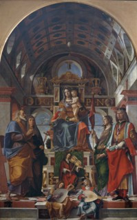 The Virgin and Child enthroned with saints and angels making music, 1499.