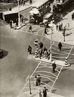 Traffic and pedestrians in Trafalgar Square, London