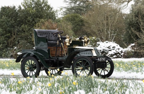 1904 De Dion Bouton model Q in snow with daffodils at Beaulieu. Creator: Unknown.