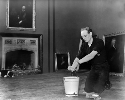 Edward, Lord Montagu of Beaulieu scrubbing floors in Palace House 1952. Creator: Unknown.
