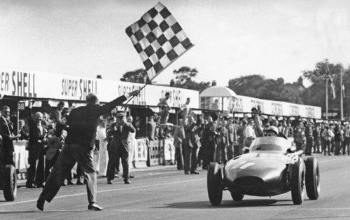 Stirling Moss winning 1957 British Grand Prix at Aintree in the Vanwall. Creator: Unknown.