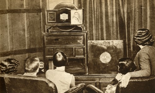 People watching an early television broadcast, c1930, (1933). Creator: Unknown.